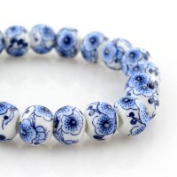 Blue Hibiscus Flowers in White Porcelain Beaded Bracelet